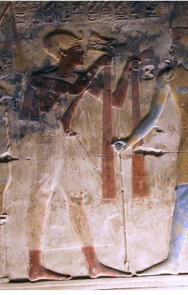 Seti I offering red linen to Amun-Râ.