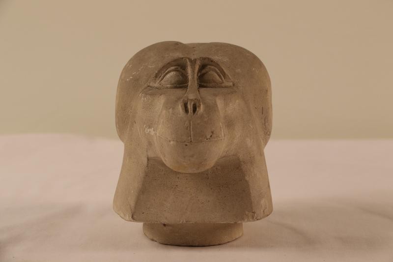 Limestone canopic jar lid in the form of a baboon s head from abydos 