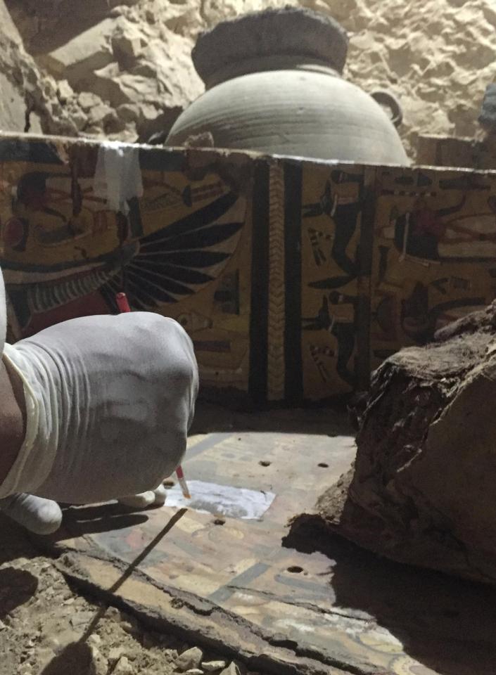 An Egyptian archaeologist documents the content of the tomb of Userhat 