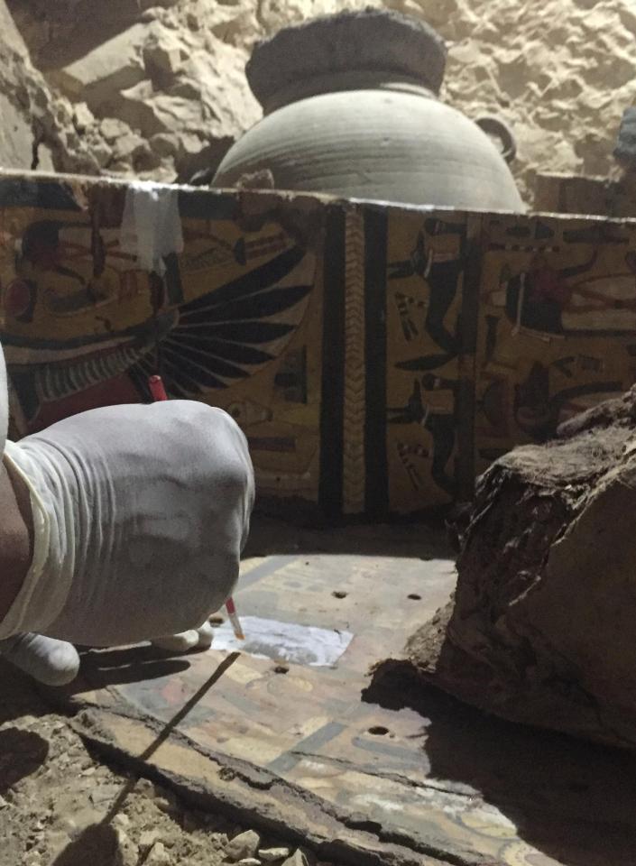 An Egyptian archaeologist documents the content of the tomb of Userhat 