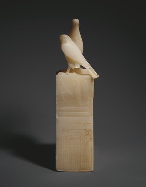 Seated statuette of pepy i with horus falcon